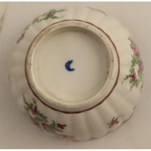 635 - A Worcester fluted tea bowl and saucer decorated with landscape panels, possibly by O'Neil, to blue ... 