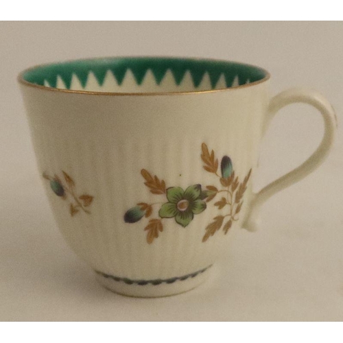 636 - A Worcester part ribbed tea bowl and saucer, decorated with greens and flower sprays