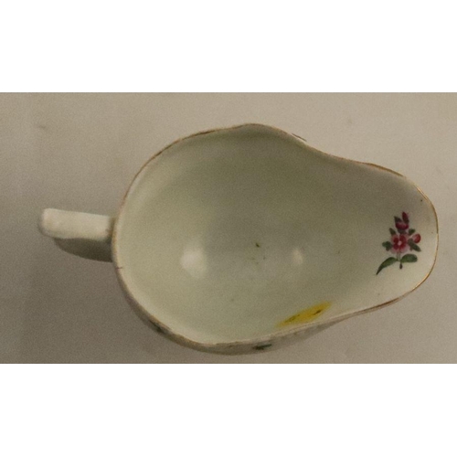 643 - A Worcester moulded sauce boat, decorated with reserves of flowers, length 5ins