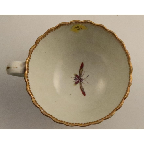 648 - A fluted Worcester teacup, decorated with birds to a blue border, together with a tea bowl with flow... 