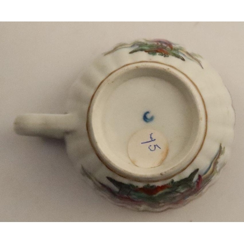 648 - A fluted Worcester teacup, decorated with birds to a blue border, together with a tea bowl with flow... 