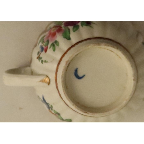 654 - A Worcester tea bowl, coffee cup and saucer, all fluted and all decorated with flowers to a dark blu... 