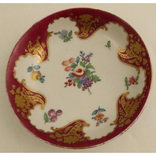 660 - A Worcester tea bowl and saucer, later decorated with the Hope Edwards pattern of flowers, fruits an... 