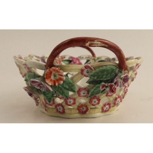 671 - A Worcester basket, painted in colours with the open trellis pattern with a yellow ground. length 7.... 