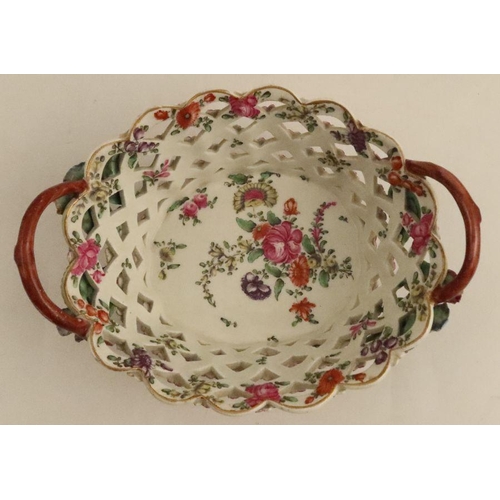 671 - A Worcester basket, painted in colours with the open trellis pattern with a yellow ground. length 7.... 