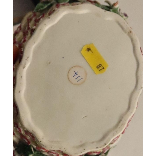 671 - A Worcester basket, painted in colours with the open trellis pattern with a yellow ground. length 7.... 