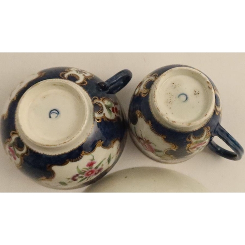 682 - A Worcester scale blue trio, decorated with reserves of flowers, saucer with script W mark - - No da... 