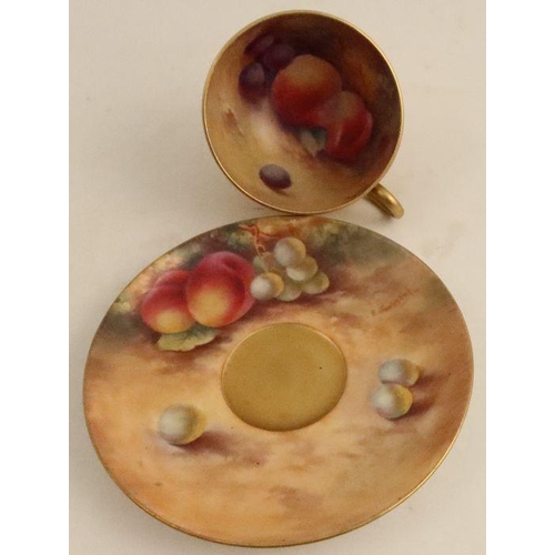 696 - A Royal Worcester cup and saucer, the interior of the cup and the saucer decorated with fruit to a m... 