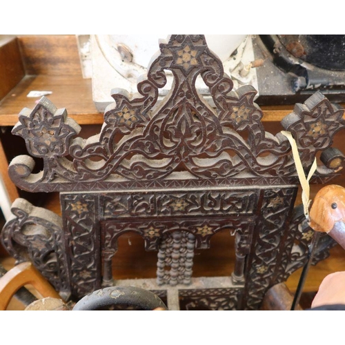 71 - An Eastern style oak stick stand, having carved decoration all over, width 22ins, height 21ins