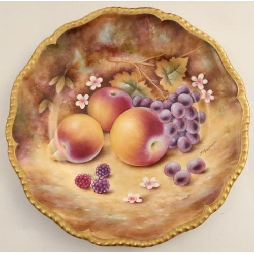 715 - A Royal Worcester cabinet plate, decorated with fruit to a mossy background by J Bowman, with a shap... 