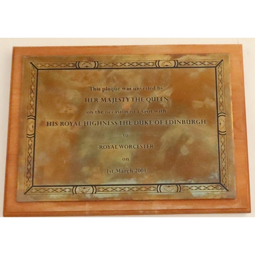 719 - A rectangular brass plaque, with presentation inscription, This plaque was unveiled by Her Majesty T... 