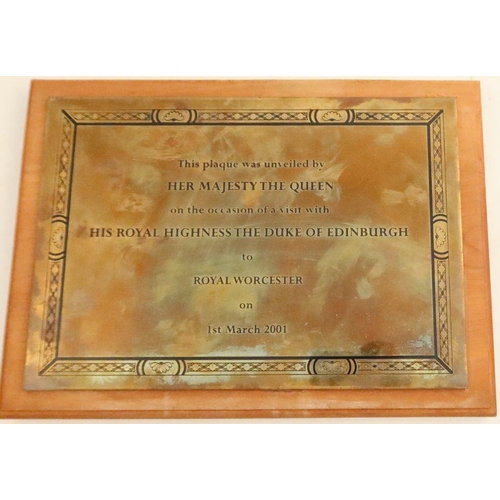 719 - A rectangular brass plaque, with presentation inscription, This plaque was unveiled by Her Majesty T... 