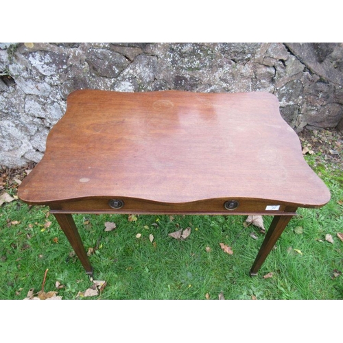 77 - A mahogany side table, having a wavy edge, with frieze drawer, width 33ins x 23ins, height 25ins