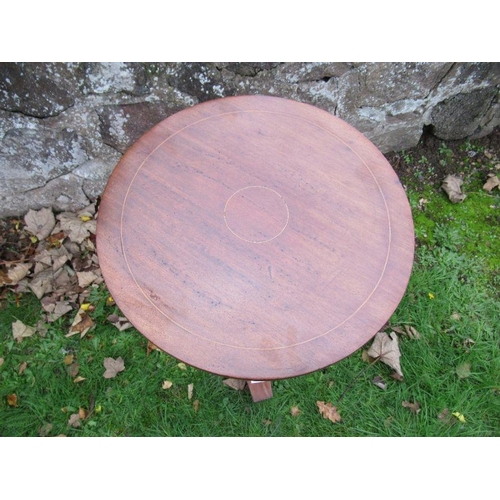 84 - A 19th century circular occasional table, with circular line inlay, raised on carved and turned colu... 