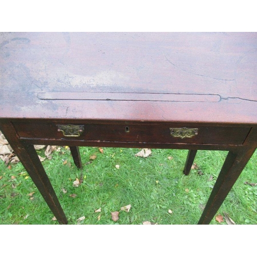 97 - A 19th century mahogany writing table with ratcheted rising top, width 27ins, height 27ins