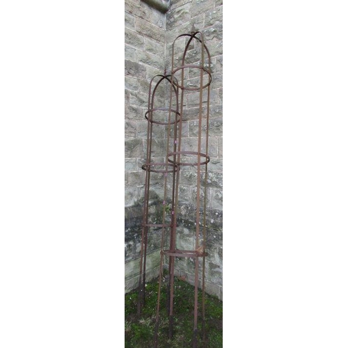 76 - Two metal obelisks