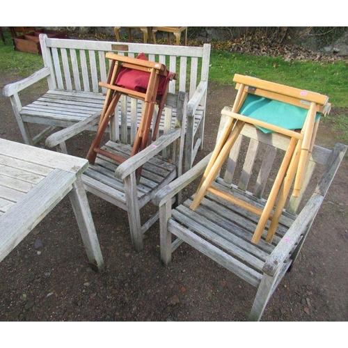 77 - A collection of garden furniture to include benches, table, tools etc
