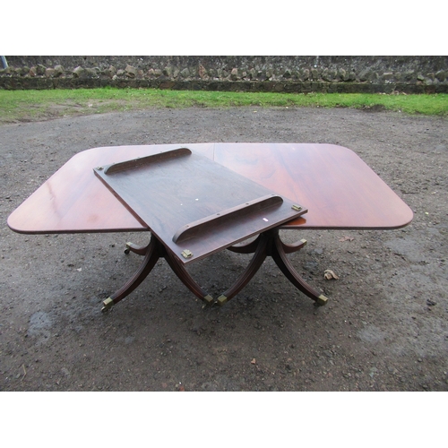 59A - A Regency design mahogany twin pillar dining table, with a leaf