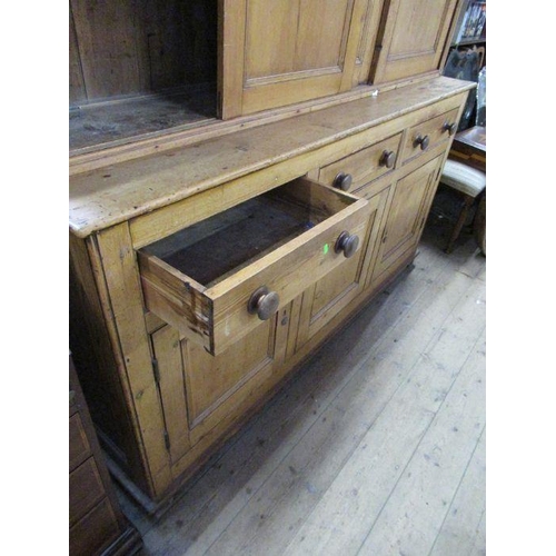 91 - A country pine cupboard dresser, the upper section having sliding doors to reveal shelves, width 75i... 