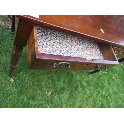 14 - A 19th century mahogany washstand,fitted two frieze drawers, raised on turned legs, 36ins x 19.5ins,... 