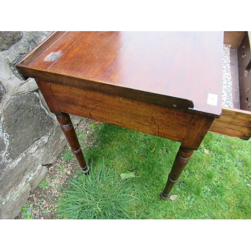 14 - A 19th century mahogany washstand,fitted two frieze drawers, raised on turned legs, 36ins x 19.5ins,... 