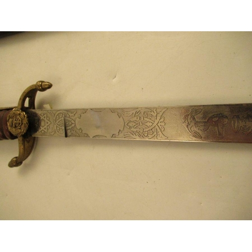 185 - A British Royal Navy midshipman's dirk, with etched blade and scabbard, length 24.5ins