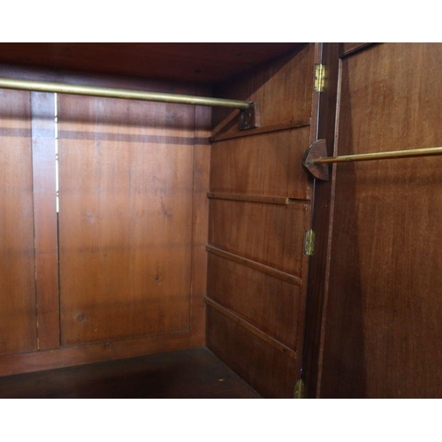 2 - A 19th century mahogany linen press, the upper section having a pair of fielded doors opening to rev... 