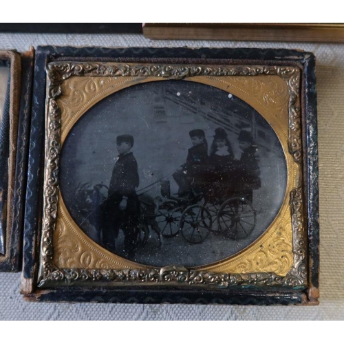 202 - Two Victorian daguerreotypes, a portrait of a child and another of three children in a trap pulled b... 