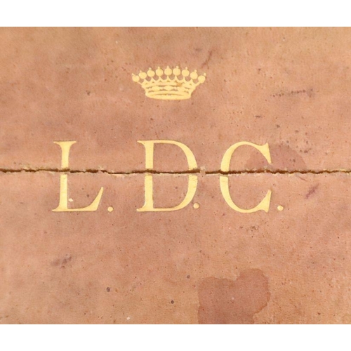 203 - A leather travelling box of rectangular form with a raising lid monogrammed LDC under a coronet  to ... 