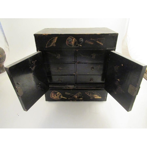 227 - A late 19th century Japanese table cabinet fitted with draws and cupboard decorated with fans  width... 