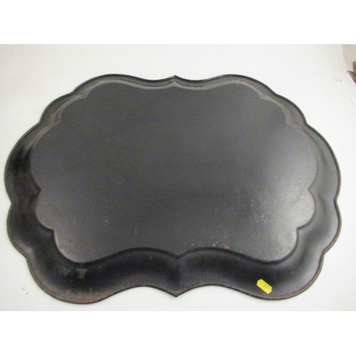 228 - A 19th century toleware tray the ebonized ground decorated in guilt and mother of pearl with a fishi... 