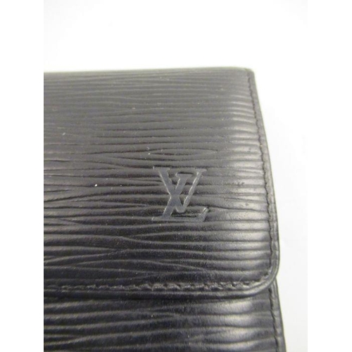 242 - An Louis Vuitton black leather purse.