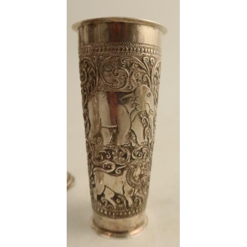 295 - A collection of Indian white metal, to include a pair of vases, height 6.25ins, a single vase and tw... 