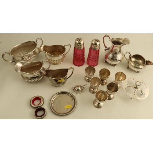 298 - A collection of silver plated items, to include egg cups, jugs, sugar bowls etc, together with a pai... 