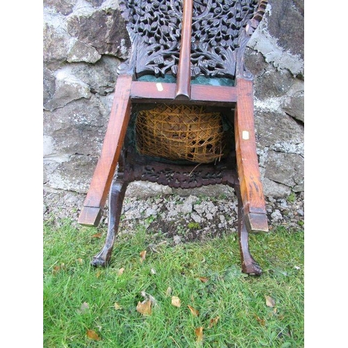 31 - A pair of Anglo-Indian hardwood chairs, with pierced and carved decoration -  Both chairs are ricket... 