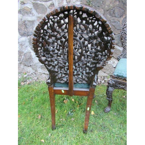 31 - A pair of Anglo-Indian hardwood chairs, with pierced and carved decoration -  Both chairs are ricket... 