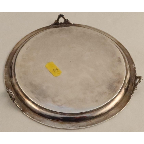 319 - An American Gorham silver waiter, of circular form with engraved decoration and initials, on three p... 