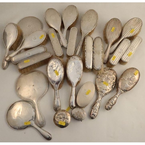 321 - Twenty-five pieces of hallmarked silver dressing table items, to include various brushes, hand mirro... 