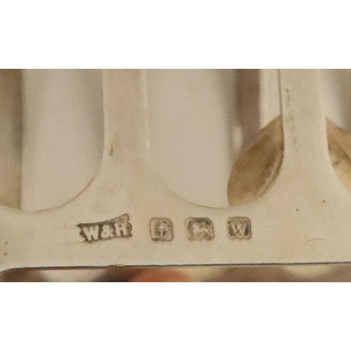 323 - Two silver five bar toast racks, Birmingham 1946, maker Walker and Hall, and Sheffield 1936, weight ... 