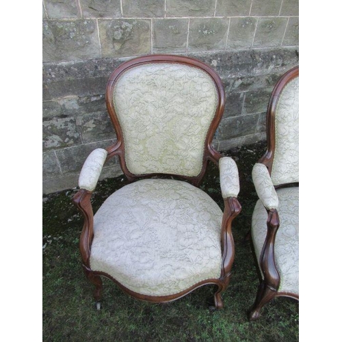 33 - A set of four Victorian show wood open arm chairs