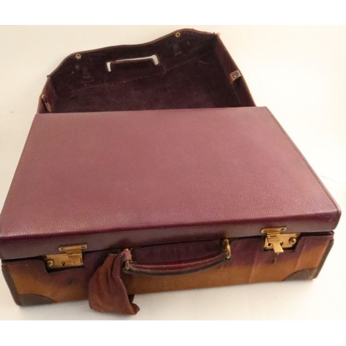 332 - A leather covered travelling case, with cloth outer cover, the interior fitted with silver mounted g... 