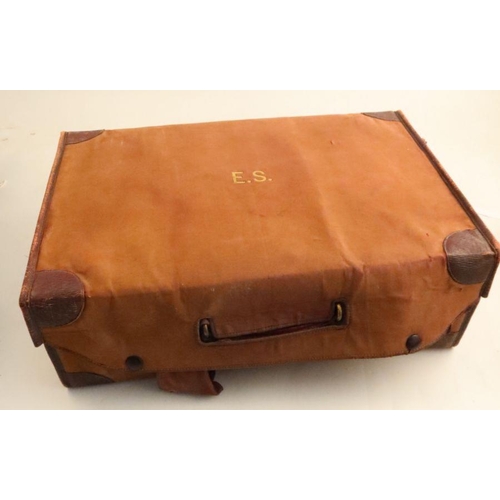 332 - A leather covered travelling case, with cloth outer cover, the interior fitted with silver mounted g... 