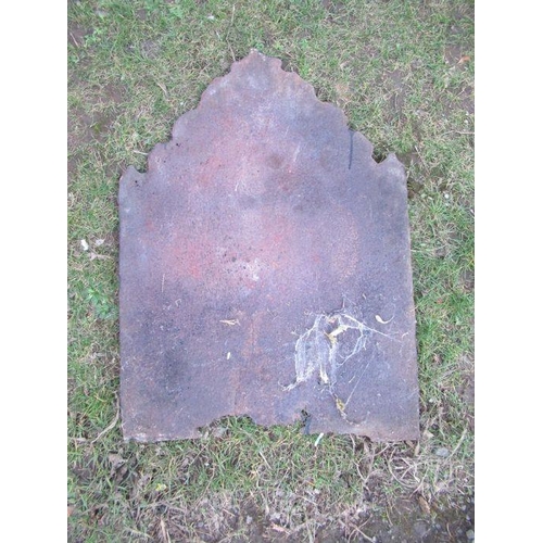 34 - An Antique cast iron fire back, embossed with a couple under a tree, 29ins x 21.5ins