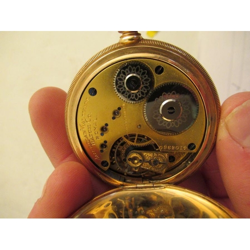 353 - A 14k gold Walton pocket watch, with enamel dial, total weight  98.9 grams