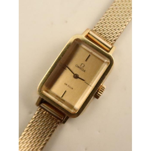 359 - A ladies Omega de Ville wrist watch, on a 9ct gold bracelet, in an Omega box