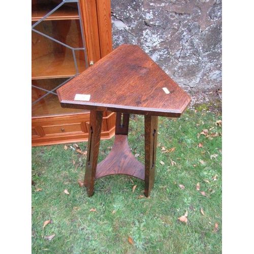 38 - An Arts and Crafts style occasional table, together with an arm chair and a corner unit.