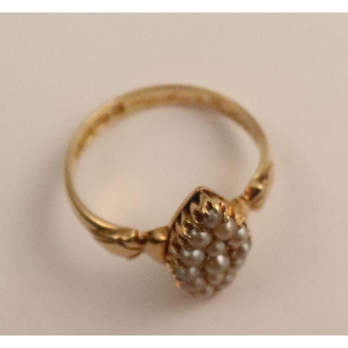 415 - A Victorian 18ct gold memorial ring, the marquise shape mount set with pearls between shaped shoulde... 