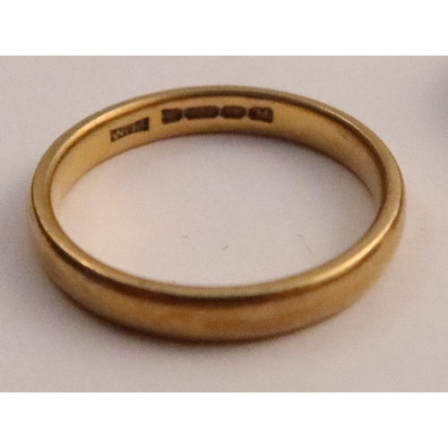 420 - A 22ct gold wedding band, weight 3.8g, together with an 18ct gold wedding band, weight 2.4g and a 9c... 