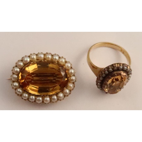 422 - A Victorian citrine and pearl oval brooch, together with a topaz and pearl ring