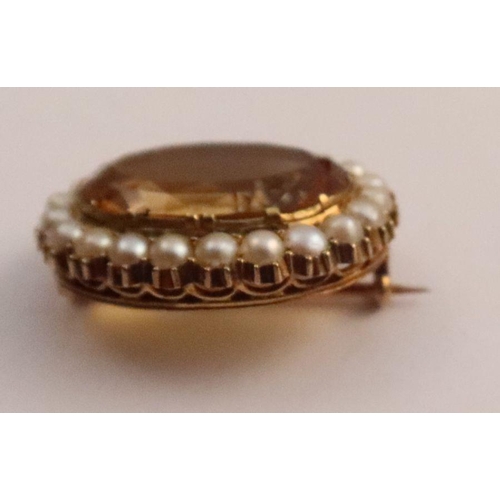 422 - A Victorian citrine and pearl oval brooch, together with a topaz and pearl ring